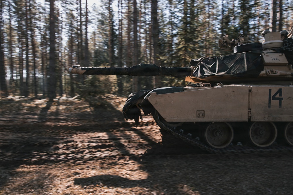 U.S. Soldiers operate Abrams tank during combined training at Camp Reedo