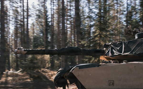 U.S. Soldiers operate Abrams tank during combined training at Camp Reedo