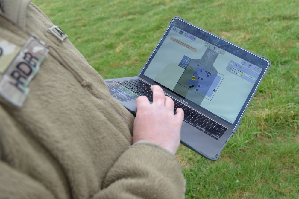 Indiana National Guard soldiers test electronic targets during casualty evacuation training