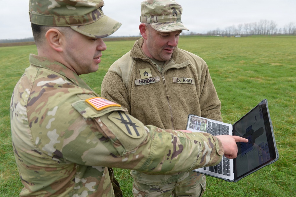Indiana National Guard soldiers test electronic targets during casualty evacuation training