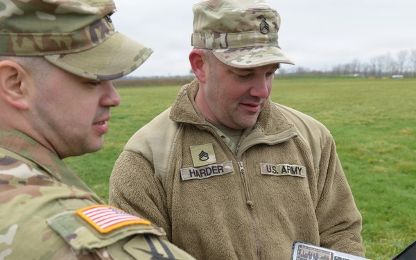 Indiana National Guard soldiers test electronic targets during casualty evacuation training