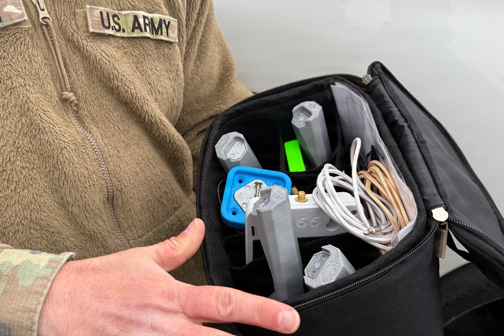 Indiana National Guard soldiers test electronic targets during casualty evacuation training
