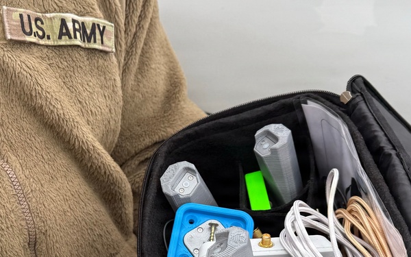 Indiana National Guard soldiers test electronic targets during casualty evacuation training