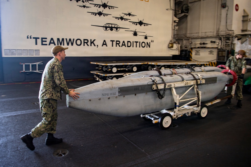 Sailors Move Aircraft Equipment