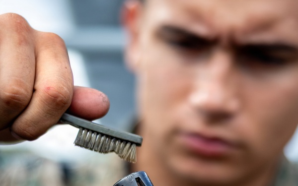 11th MEU Marines, Sailors Conduct Weapons Maintenance Aboard USS Comstock