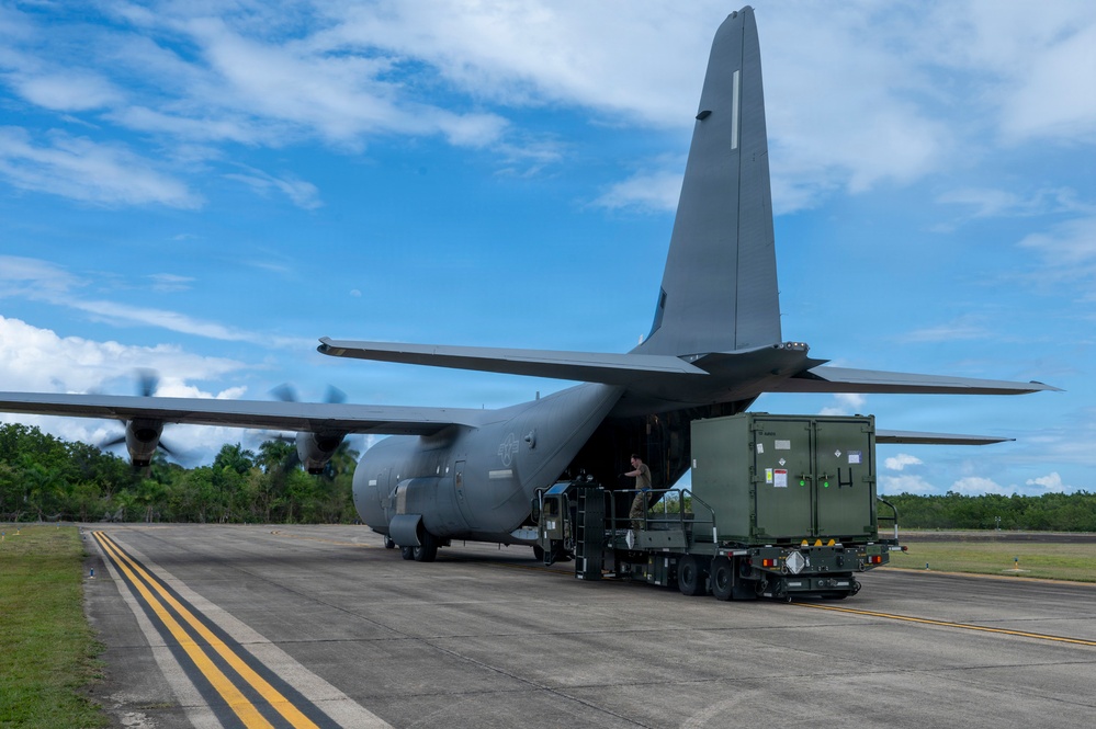 346th Air Expeditionary Wing unloads cargo off a C-130J