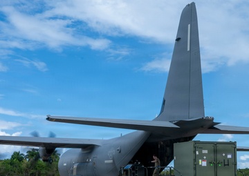 346th Air Expeditionary Wing unloads cargo off a C-130J