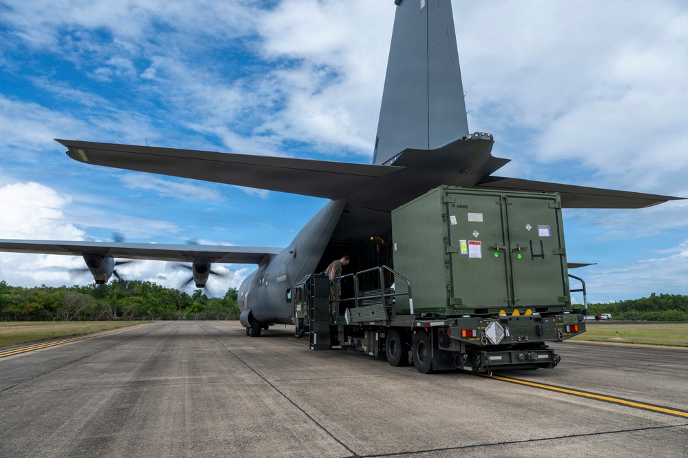 346th Air Expeditionary Wing unloads cargo off a C-130J