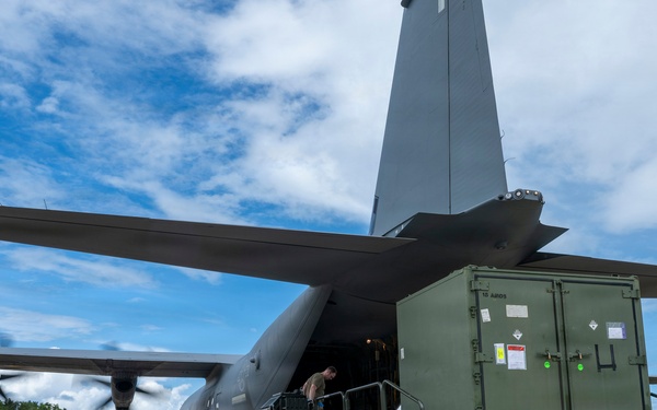 346th Air Expeditionary Wing unloads cargo off a C-130J