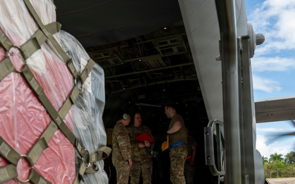 346th Air Expeditionary Wing unloads cargo off a C-130J