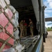 346th Air Expeditionary Wing unloads cargo off a C-130J