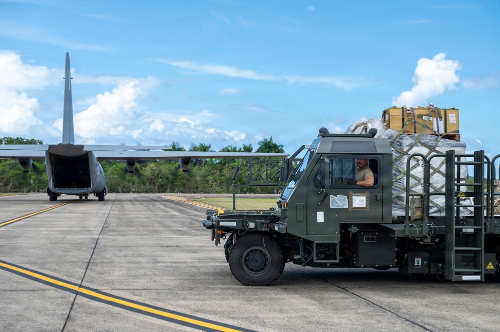 346th Air Expeditionary Wing unloads cargo off a C-130J
