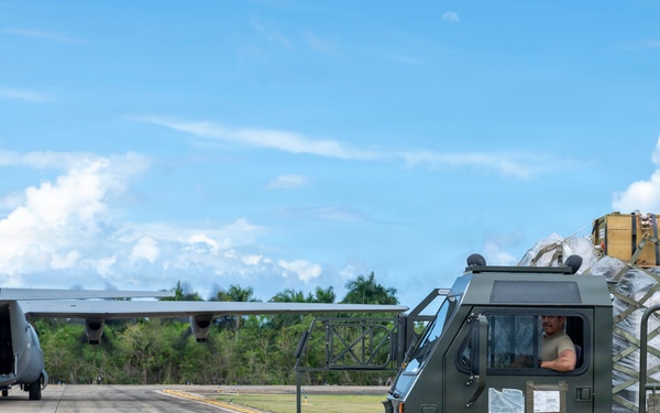 346th Air Expeditionary Wing unloads cargo off a C-130J