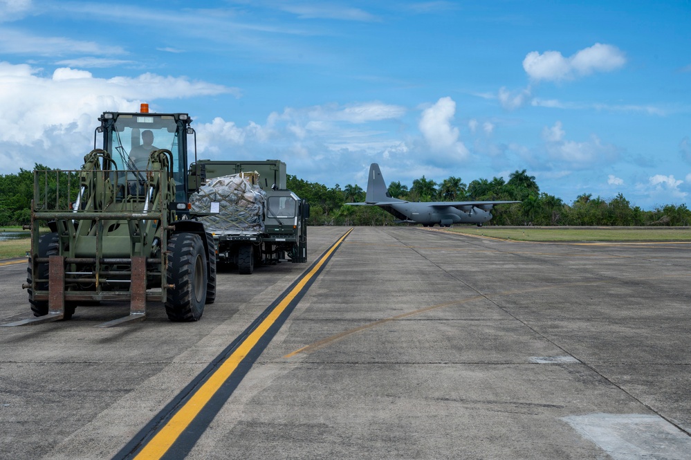 346th Air Expeditionary Wing unloads cargo off a C-130J
