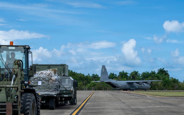 346th Air Expeditionary Wing unloads cargo off a C-130J