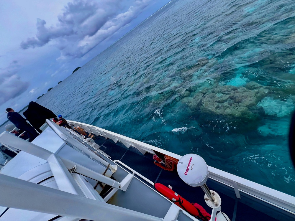 USCGC Oliver Henry (WPC 1140) carefully navigates into Kapingamarangi Atoll lagoon