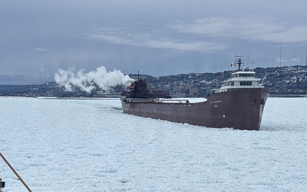 Coast Guard Cutter SPAR (WLB 206) assists motor vessel Lee A. Tregurtha, beset by ice on Lake Superior