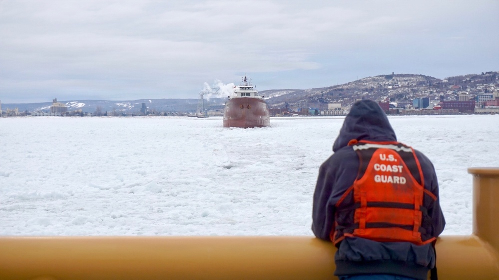 Coast Guard Cutter SPAR (WLB 206) assists motor vessel Lee A. Tregurtha, beset by ice on Lake Superior