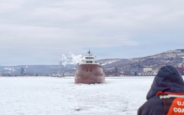 Coast Guard Cutter SPAR (WLB 206) assists motor vessel Lee A. Tregurtha, beset by ice on Lake Superior