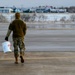 174th Attack Wing Airman conducts FOD walk in winter weather
