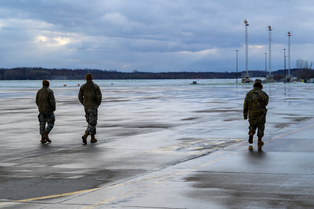 174th Attack Wing Airmen conduct FOD walk in winter conditions