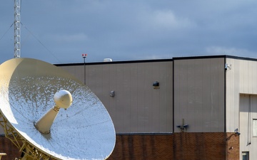 Radar dish covered in snow during FOD walk