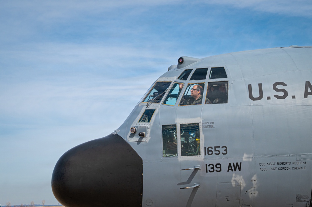 139th Airlift Wing vice-commander is greeted by his children after fini-flight
