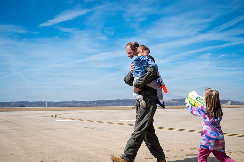 139th Airlift Wing vice-commander is greeted by his children after fini-flight