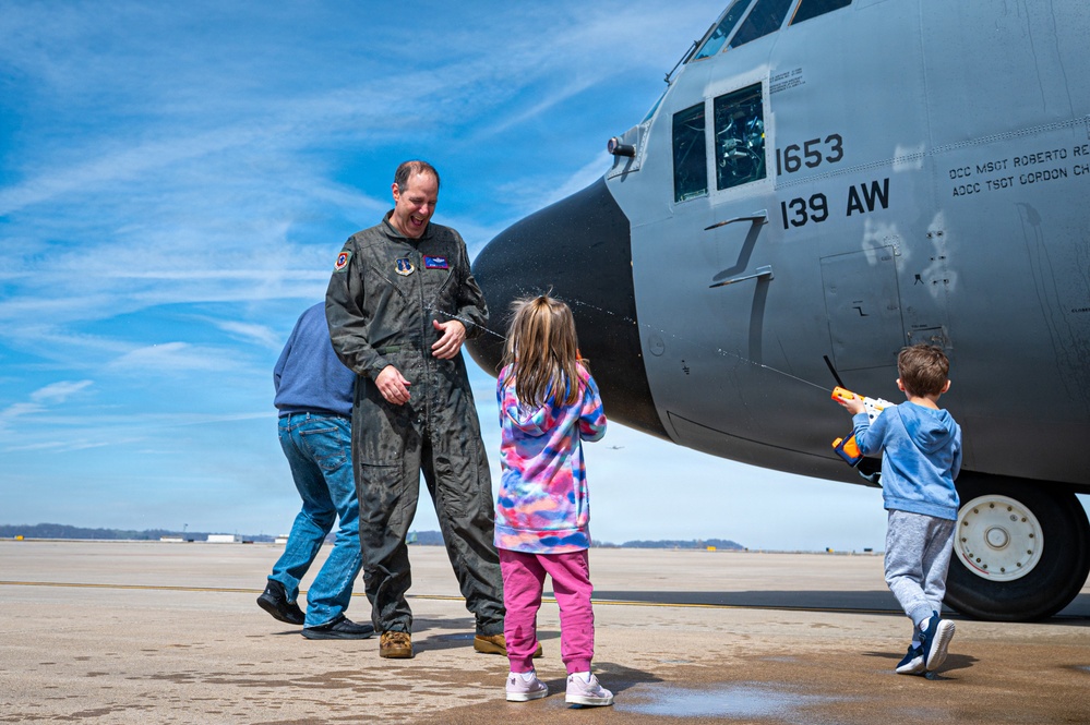 139th Airlift Wing vice-commander is greeted by his children after fini-flight