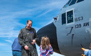 139th Airlift Wing vice-commander is greeted by his children after fini-flight