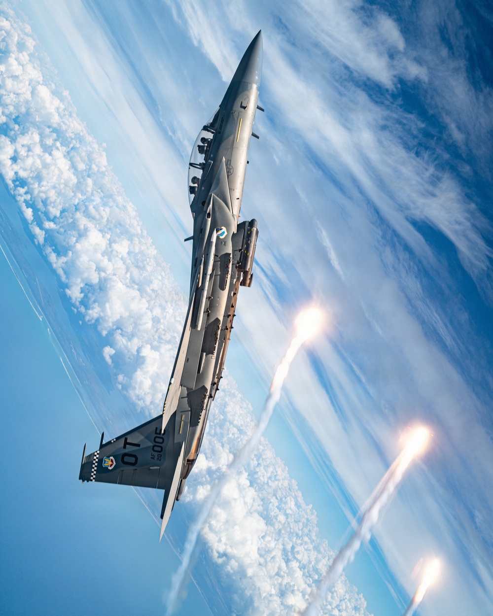 An F-15EX Eagle Releases Flares Over the Gulf Coast