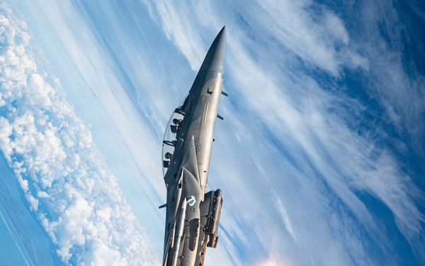 An F-15EX Eagle Releases Flares Over the Gulf Coast
