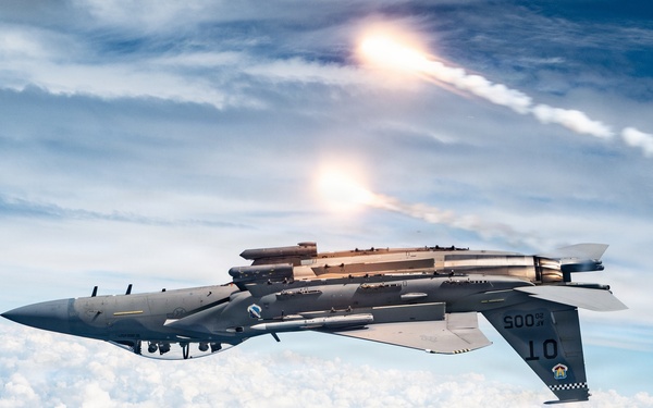 An F-15EX Eagle Releases Flares Over the Gulf Coast