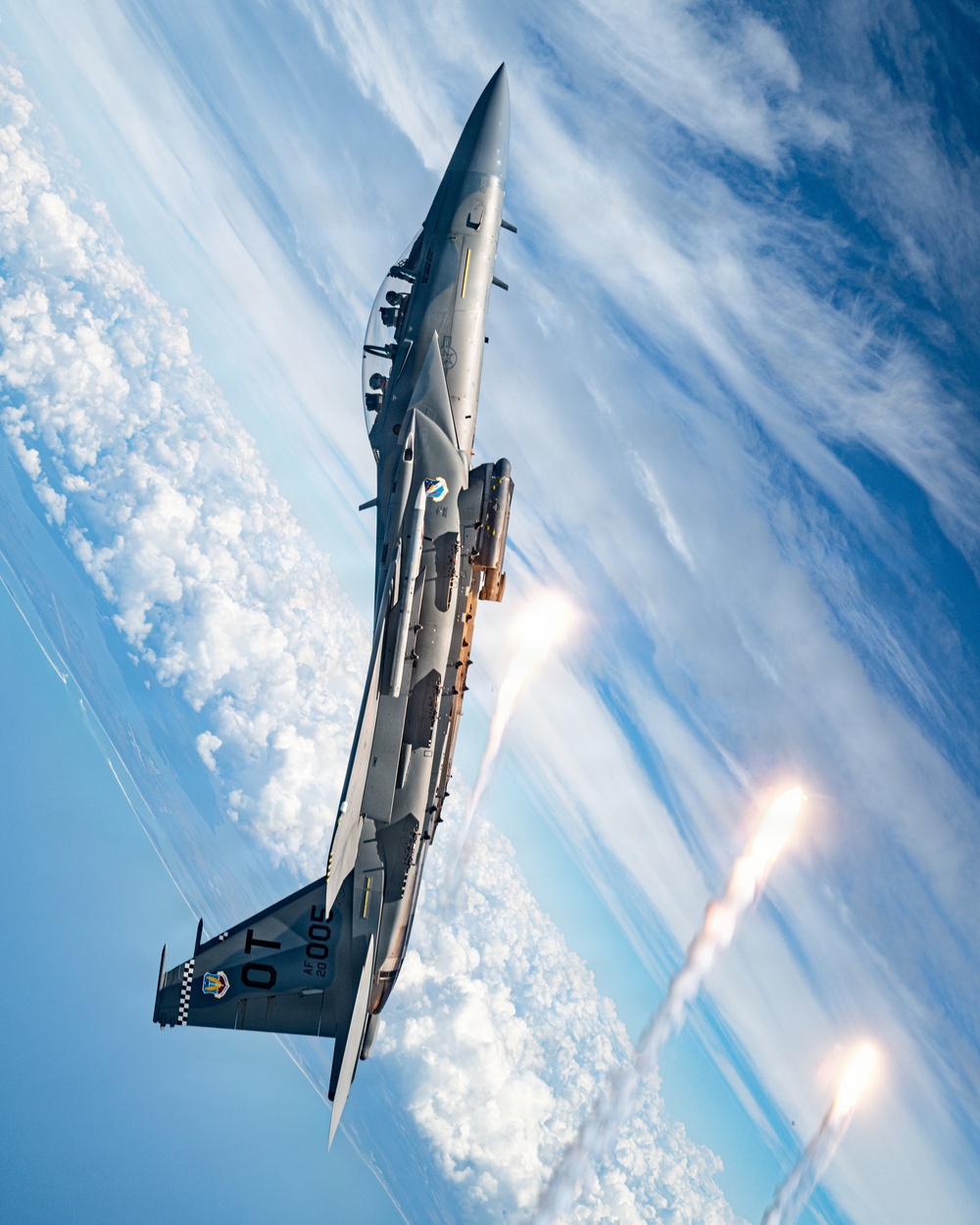An F-15EX Eagle Releases Flares Over the Gulf Coast