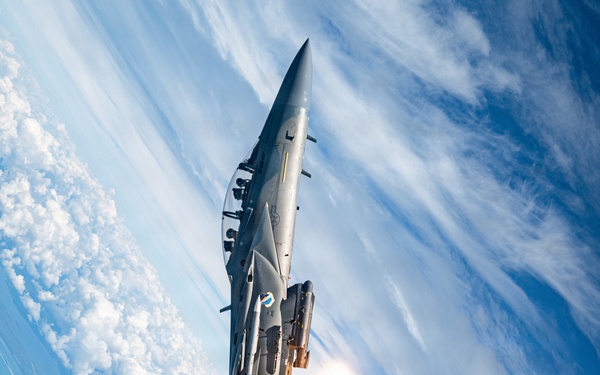An F-15EX Eagle Releases Flares Over the Gulf Coast