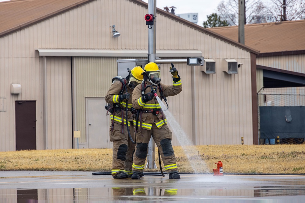 U.S. Marines execute simulated aircraft firefighting drill