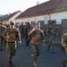 U.S. Soldiers and NATO Forward Land Forces Battle Group-Poland ruck march side-by-side