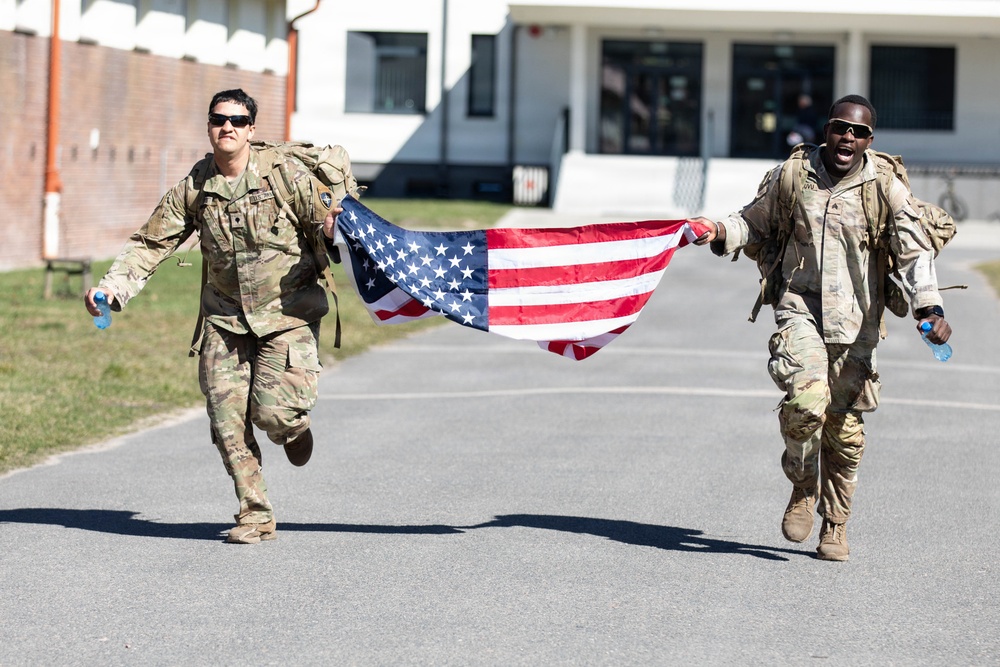 U.S. Soldiers and NATO Forward Land Forces Battle Group-Poland ruck march side-by-side