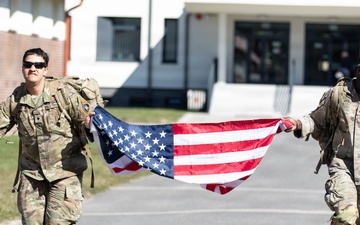 U.S. Soldiers and NATO Forward Land Forces Battle Group-Poland ruck march side-by-side