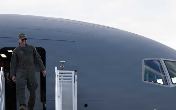 U.S. Air Force Maj. Kyle Hadel celebrates his final flight