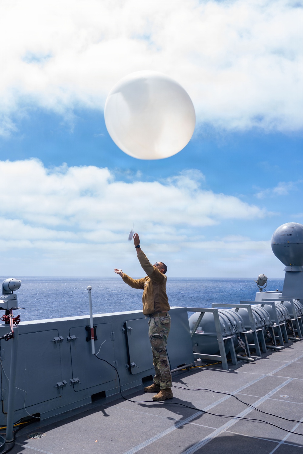 U.S. Airmen Assigned to the 45th Weather Squadron Launch Weather Balloon.