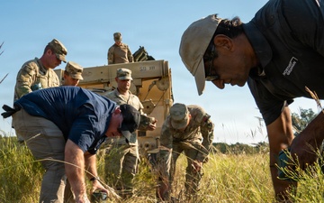 Personnel inspect and organize deployed M139 inert munitions (M88R)