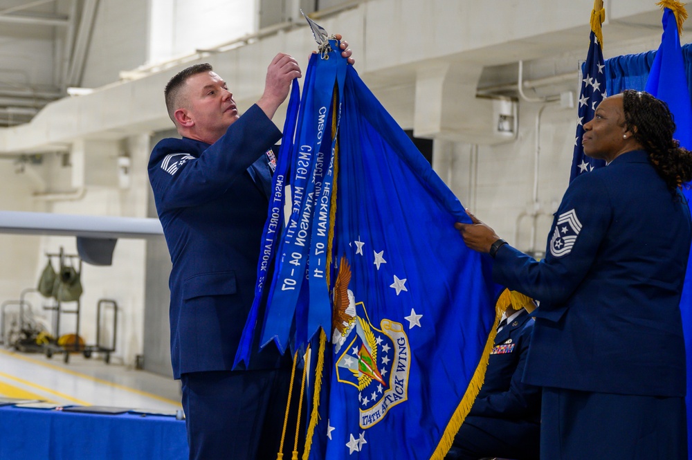 Command chief adds streamer during change of responsibility ceremony
