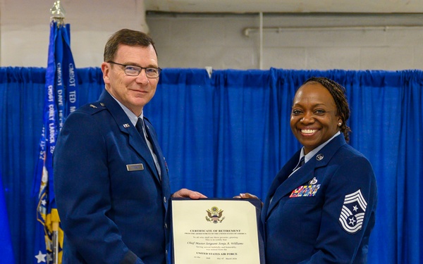 Former command chief receives retirement certificate at Hancock Field
