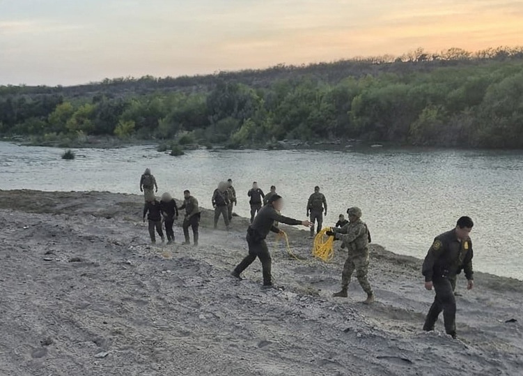 U.S. Border Patrol agents, Texas state troopers, and U.S. Army soldiers assigned to JTF-SB rescue three Illegal aliens attempting to cross the U.S southern border.