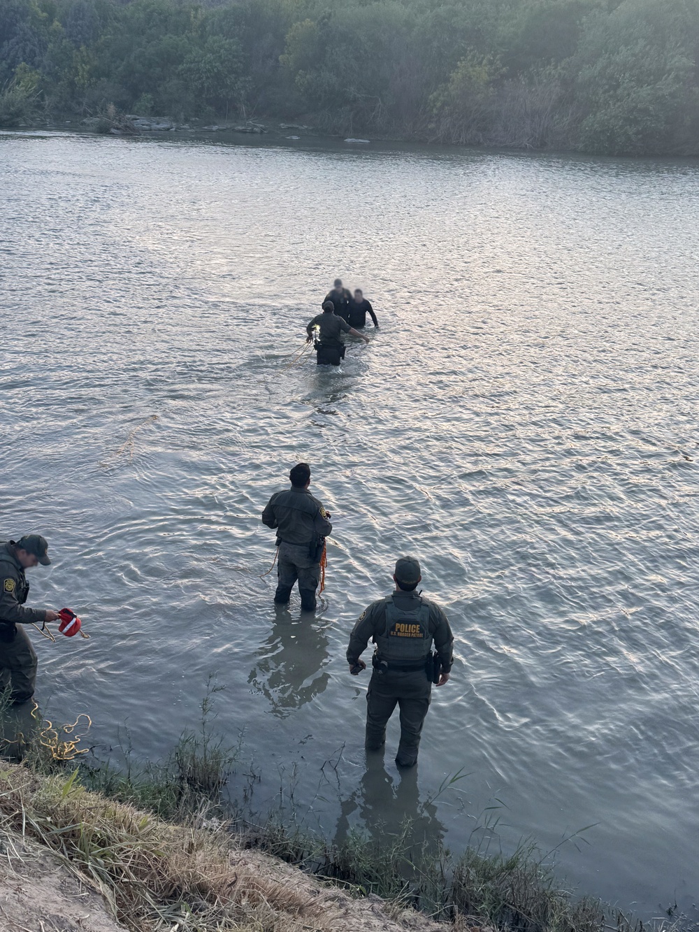 U.S. Border Patrol agents, Texas state troopers, and U.S. Army soldiers assigned to JTF-SB rescue three Illegal aliens attempting to cross the U.S southern border.