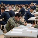 USS Carl Vinson (CVN 70) Sailors take the Advancement Exam