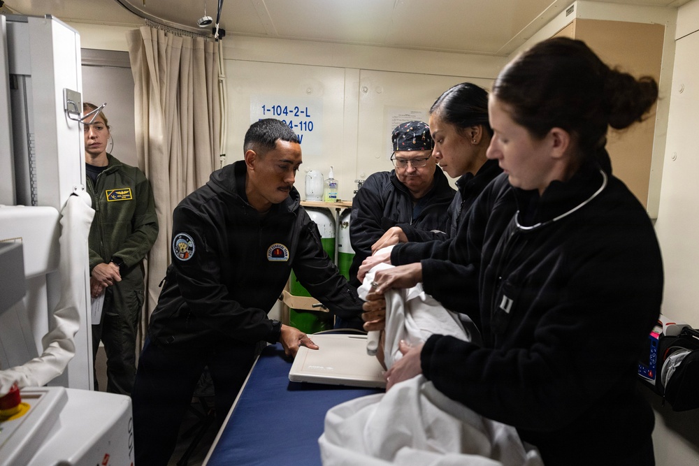 Sailors from USS John P. Murtha, Fleet Surgical Teams 1 and 9, Naval Medical Center San Diego conduct medical drill ahead of Artemis II recovery operations