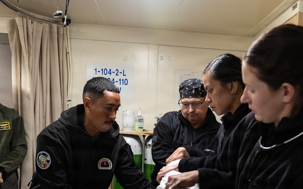 Sailors from USS John P. Murtha, Fleet Surgical Teams 1 and 9, Naval Medical Center San Diego conduct medical drill ahead of Artemis II recovery operations