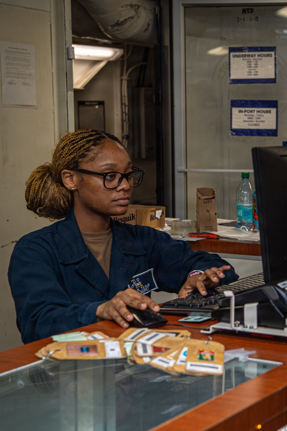 Nimitz Sailor Works in Ship Store